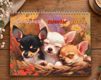 May include: A 2027 wall calendar featuring a colorful painting of three Chihuahua dogs resting in a woven basket. The black, white, and tan dogs are nestled together against a backdrop of orange and yellow flowers. The text reads Chihuahua calendar 2027.