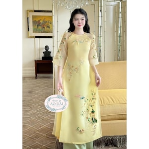 Yellow Ao Dai Cach Tan Set: Modern Vietnamese Dress with Pants