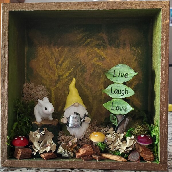 Gnome Shadow Box - green, brown, white, gold paint pour on a 6x6 wood shadow box - Gnome scape added on the open side.