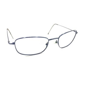 May include: A pair of eyeglasses featuring a thin, dark blue metal frame with a rectangular lens shape. The glasses include slender metal temples and adjustable nose pads, providing a lightweight and functional design for clear vision correction.