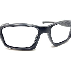 May include: Black rectangular frame eyeglasses with a sleek, modern design.