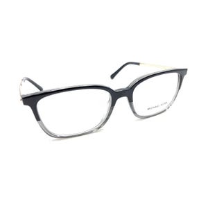May include: Michael Kors eyeglasses featuring a two-tone frame with a solid black upper rim and a translucent gray lower rim. The temples are thin and gold-toned, and the brand name Michael Kors is printed in small black letters on the right lens.