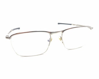 Oakley Conductor 0.5 OX3187-0353 Montature per occhiali cromate lucide 53-18 137 Uomo