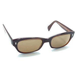 Luxottica Memorize 6504 3004 Brown Oval Eyeglasses Frames 51-19-140 Mens Womens Tess Oval Tortoise Pearl Photochromic Glasses | GlassesShop main image 4