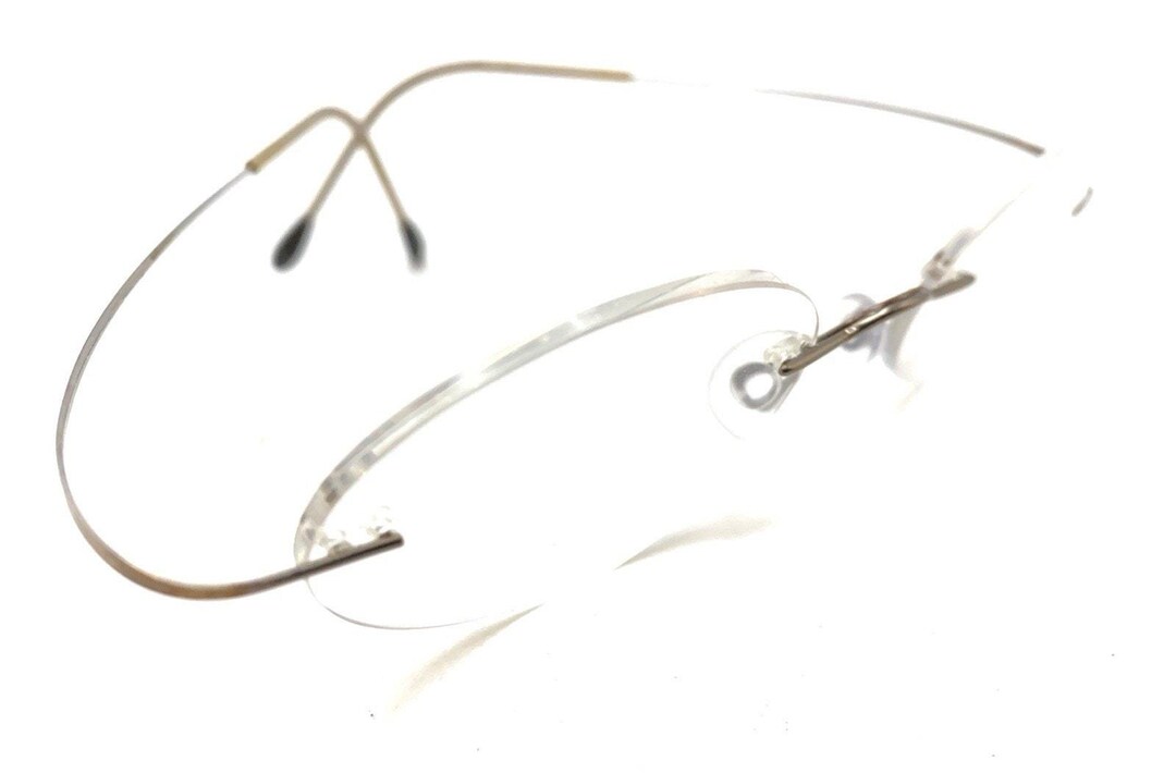 Suntan Rimless Frame Silhouette Titanium Silver Tan Oval Rimless Eyeglasses Frames Austria ...