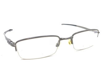 Monturas de anteojos Oakley Rhinochaser OX3111-0152 gris cemento con media montura 52-19 143