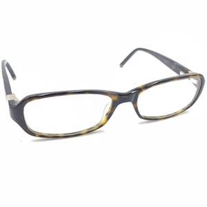 May include: Tortoise shell eyeglasses with a rectangular frame and clear lenses.