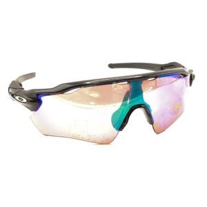 May include: Black sports sunglasses with a wraparound design. The lenses have a gradient of colours, including pink, blue, and green. The frame is black with the Oakley logo on the side.