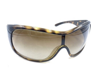 Prada Tortoise Brown Gold Shield Wrap Gafas de sol Lente marrón 120 Diseñador de Italia