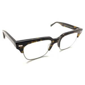 May include: Browline glasses featuring a thick, tortoiseshell-patterned acetate upper frame and thin, silver-toned metal rims along the bottom. The temples are also made of matching tortoiseshell acetate, and the bridge connects the two lenses.