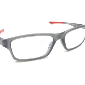 May include: Gray rectangular eyeglasses with red accents on the arms.