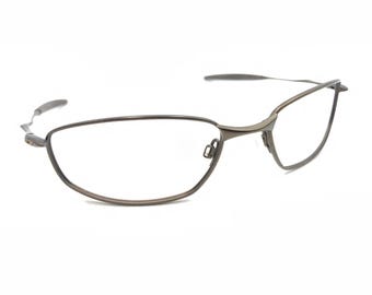Oakley Whisker 12-850 matbruin ovaal gewikkeld metalen zonnebrilmontuur 60-19 130