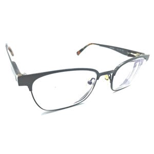 May include: Eyeglasses featuring a matte black rectangular frame with clear lenses. The temples are thin and transition into a brown and black tortoiseshell pattern at the tips. The bridge includes adjustable gold-toned nose pads for a secure fit.