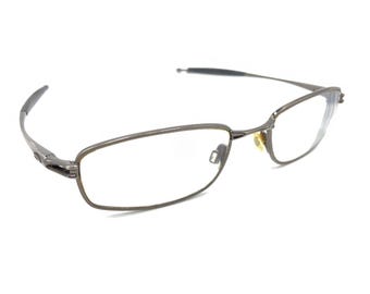 Monturas de gafas rectangulares de metal plateado y metal de Oakley para hombre y mujer