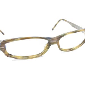 May include: A pair of brown and blue tortoiseshell eyeglasses with a rectangular frame.