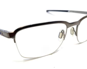 Oakley Cathode OX3233-0454 Mat bronskleurige brillenglazen met halve rand montuur 54-18 138