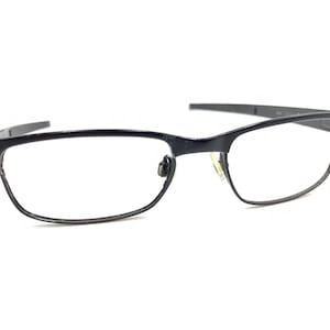 May include: Black rectangular eyeglasses with a thin metal frame.