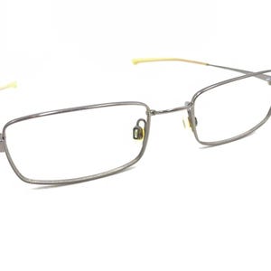 May include: Silver-toned rectangular eyeglasses with thin frames and clear lenses.