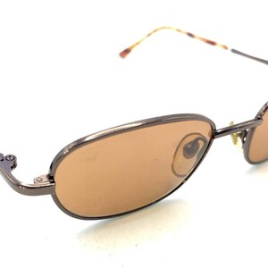 Nine & Co Womens Sunglasses Brown Striped Oval Frame Gradient Lens 22614 Nine West Oval Sunglasses for Women for sale | eBay main image 4