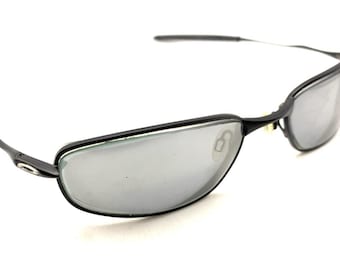 Oakley Whisker 6B OX3107-0155 Zwarte ovale wikkelzonnebril montuur 55-18 132 Sports