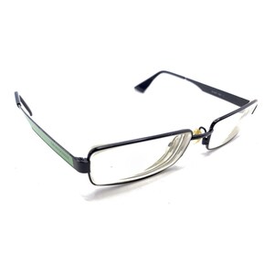 May include: Rectangular eyeglasses featuring a thin black metal frame and clear lenses. The temples are accented with a distinct light green stripe along the side. The bridge includes small, metallic nose pads for support and fit.