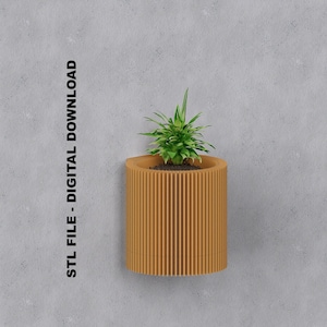 May include: A brown, ribbed, cylindrical planter with a green plant inside. The planter is mounted to a gray wall. STL FILE - DIGITAL DOWNLOAD