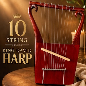 May include: A 10-string King David harp with a deep reddish-brown hue. The instrument has a rectangular soundbox, curved arms, and silver strings. The text "10 STRING KING DAVID HARP" is displayed in gold.