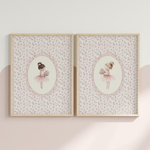 May include: Two framed prints featuring illustrations of young ballerinas. Each ballerina is depicted in a pink tutu, holding a bouquet of flowers, set against a floral patterned background. The frames are light wood.