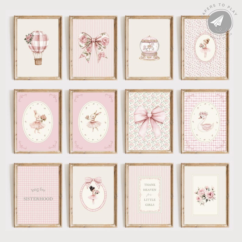 May include: A collection of twelve framed art prints with a vintage aesthetic. The prints feature watercolor illustrations of bows, hot air balloons, ballerinas, and floral arrangements in soft pink and cream tones. Some prints include text such as "Sisterhood" and "Thank Heaven for Little Girls."