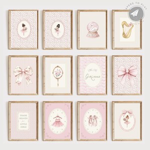May include: A collection of twelve framed art prints with a soft, feminine theme. The prints feature illustrations of ballerinas, bows, a harp, a snow globe, and the text "Long Live Girlhood" and "Thank Heaven for Little Girls". The color palette is primarily pink and beige.