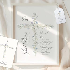 Puede incluir: Una impresión enmarcada en blanco con un diseño de cruz floral. La impresión incluye el nombre "Jacob Brown" y el texto "Soy Hermoso, Elegido, Un hijo de Dios, Hecho para un propósito, Amado para siempre".