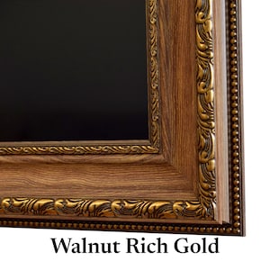 May include: A rectangular picture frame with a dark walnut wood grain finish and ornate gold-colored detailing. The frame features a beaded outer edge and a decorative inner border with scrolling patterns. The text Walnut Rich Gold is visible.