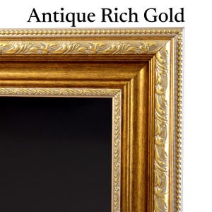 May include: An ornate picture frame in Antique Rich Gold with a deep, metallic finish. The frame features a raised beaded outer edge, a central smooth gold band, and an inner border with intricate, repeating leaf-like scrollwork patterns.