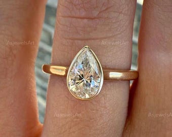 1.5 Carat E Color VVS2 Clarity IGI Certified Pear Cut Lab Grown Diamond Solitaire Engagement Ring 14k Yellow Gold Bezel Set Cigar Flat Band