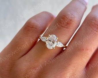 2.5 Carat IGI Certified E/VS1 Oval Cut Lab Created Three Stone Diamond Engagement Ring, Pear Cut Side Diamonds, 14k Yellow Gold