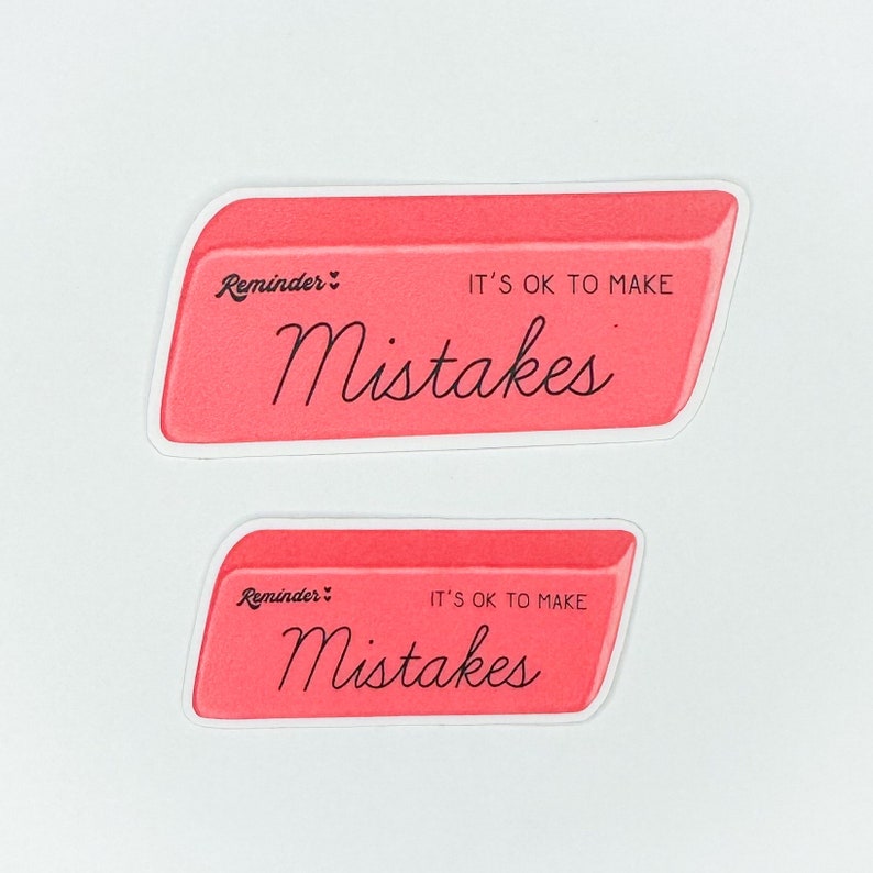 May include: Two pink eraser stickers with white borders. The top sticker says "Reminder: It's ok to make mistakes". The bottom sticker says "Reminder: It's ok to make mistakes".