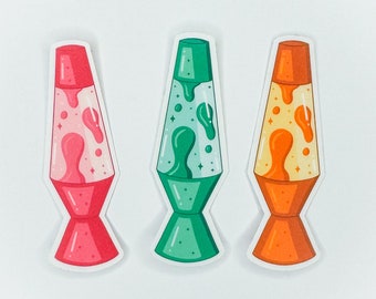 May include: Three lava lamp stickers with a retro design. The lava lamps are pink, green, and orange. Each sticker has a white outline.