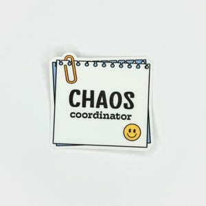 May include: White sticker with a black and white illustration of a notepad with a paperclip and the text "CHAOS coordinator" and a yellow smiley face.