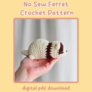 Puede incluir: Un juguete de amigurumi de hurón tejido a crochet en blanco y marrón. El juguete está siendo sostenido en una mano. El texto de la imagen dice "No Sew Ferret Crochet Pattern digital pdf download by crochetcalls".
