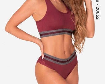 May include: A burgundy-colored two-piece lingerie set with gray trim. The top is a racerback style and the bottom is a high-waisted panty with lace detailing.