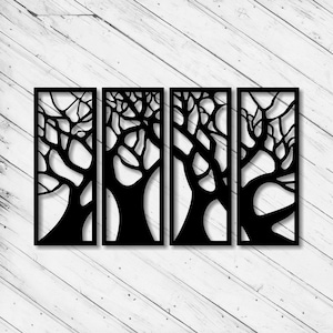 May include: Four-panel black metal wall art with a tree design. Each panel has a rectangular frame with a tree silhouette. The art is displayed against a white wooden background.