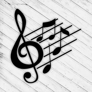May include: Black musical notes and a treble clef are displayed on a white wooden background. The musical symbols are arranged diagonally, with the treble clef on the left and the notes on the right. The image is a simple, elegant representation of music.