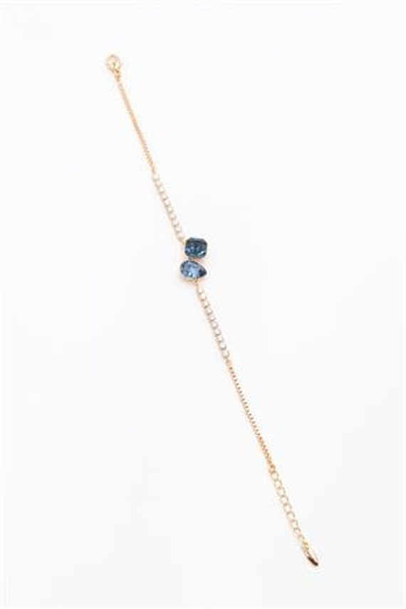 Elegant Gold Color Bracelet With Vibrant Blue Stone Trendy