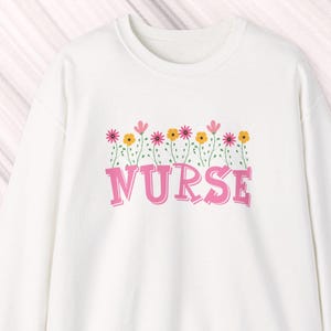 Pink Nurse Flower Sweatshirt: 50% cotton/polyester sizes S-3X