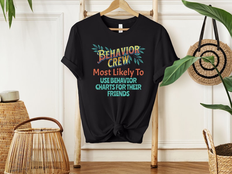 May include: Black t-shirt with a colorful graphic that says "Behavior Crew" and "Most Likely To Use Behavior Charts For Their Friends".