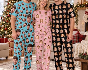 May include: Three sets of matching pajamas featuring an all-over print of individual faces. One set is light blue, one is light pink, and one is black. Each set consists of a short-sleeved crew neck t-shirt and long pajama pants.