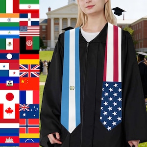 May include: A black graduation gown with two stoles. One stole features the flag of Argentina, and the other displays the American flag. A collection of flags from various countries is visible on the left side of the image.