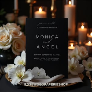 Puede incluir: Tarjeta de invitación de boda negra con texto blanco. El texto dice "estás invitado a celebrar la boda de Monica y Angel. Domingo, 24 de septiembre de 2025. Cuatro en punto de la tarde, 4289 bv. Orlando, FL 32837. Rosewoodpaperieshop."