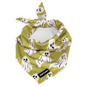 May include: A green bandana with a white ghost pattern and the text "Duck & Luca" on the bottom.