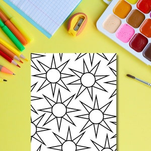 May include: A black and white coloring page with a repeating pattern of stars. The page is surrounded by art supplies, including colored pencils, a pencil sharpener, a paintbrush, and a watercolor palette.